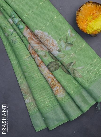 Linen cotton saree light green with floral prints & sequin work and silver zari woven border