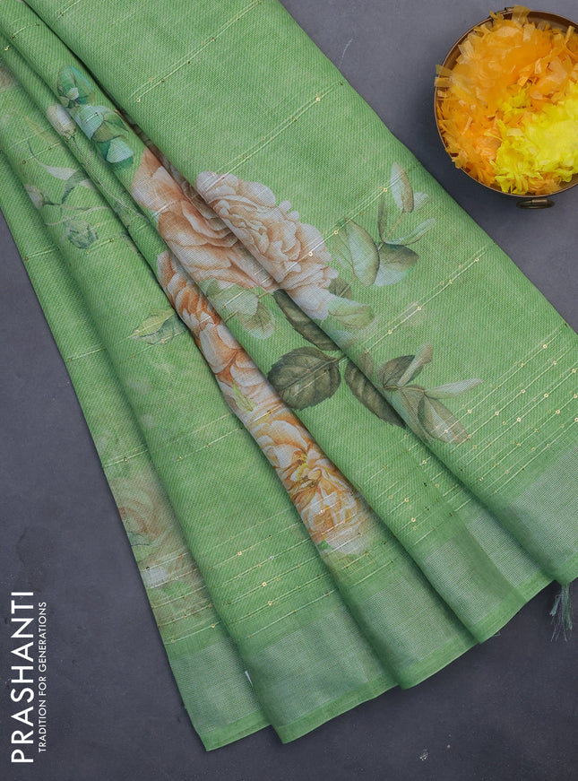Linen cotton saree light green with floral prints & sequin work and silver zari woven border