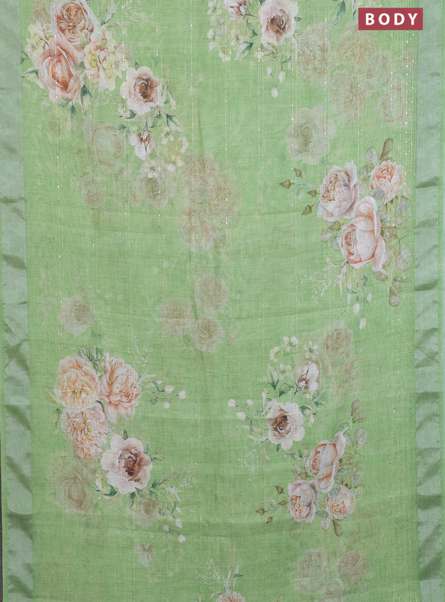 Linen cotton saree light green with floral prints & sequin work and silver zari woven border