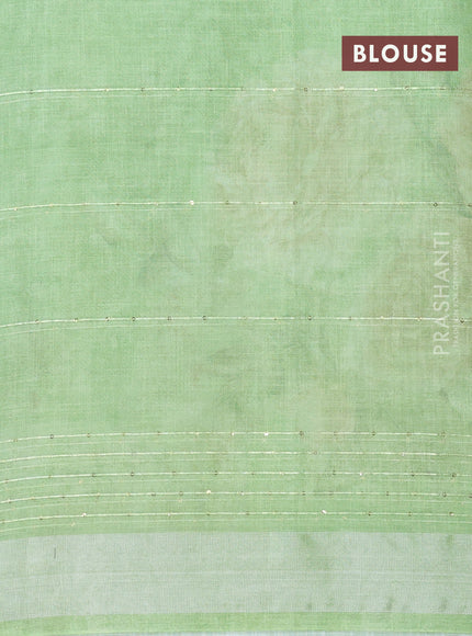 Linen cotton saree light green with floral prints & sequin work and silver zari woven border