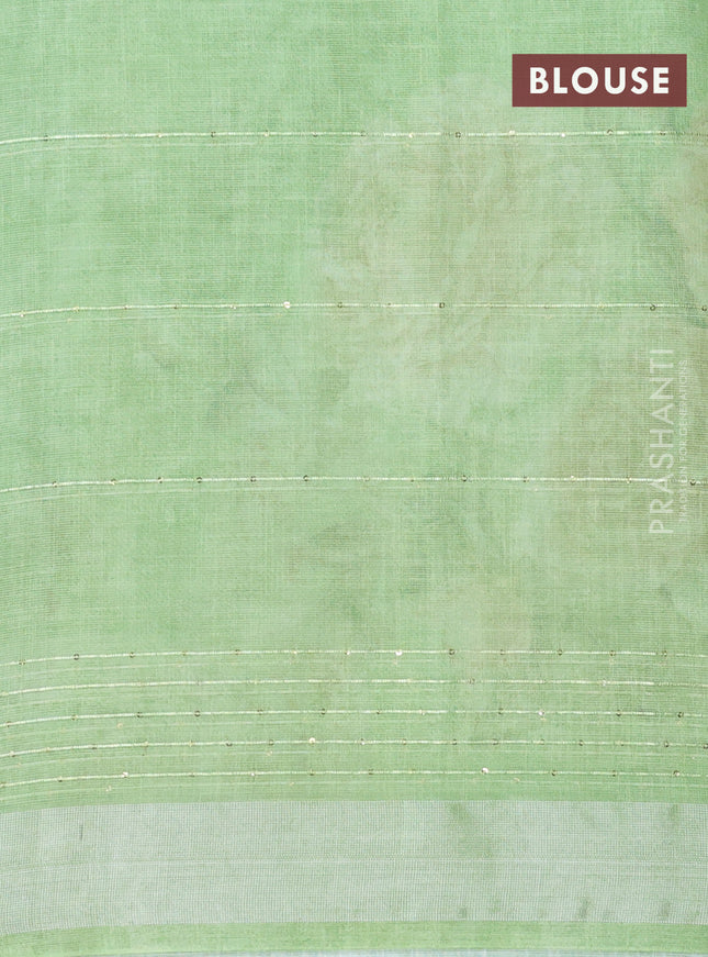 Linen cotton saree light green with floral prints & sequin work and silver zari woven border