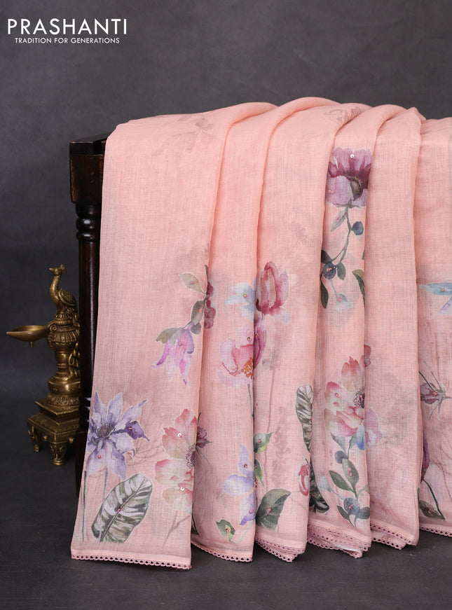 Linen cotton saree pastel peach orange with floral digital prints & embroidery buttas and lace work border