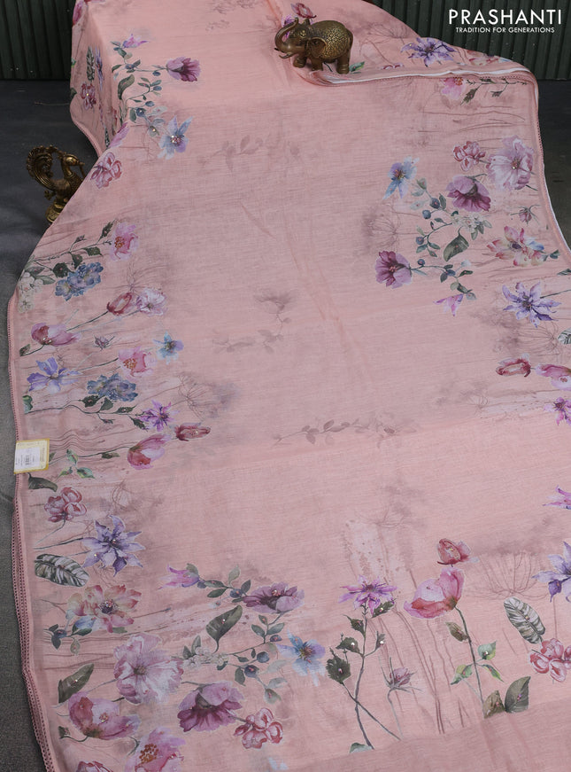 Linen cotton saree pastel peach orange with floral digital prints & embroidery buttas and lace work border