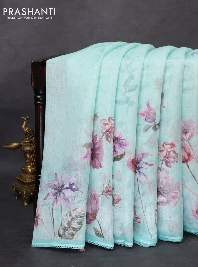 Linen cotton saree teal blue shade with floral digital prints & embroidery buttas and lace work border