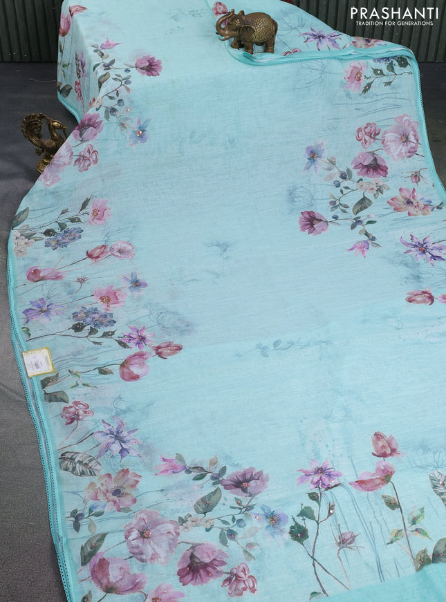 Linen cotton saree teal blue shade with floral digital prints & embroidery buttas and lace work border