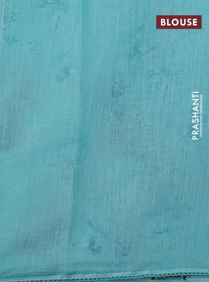 Linen cotton saree teal blue shade with floral digital prints & embroidery buttas and lace work border