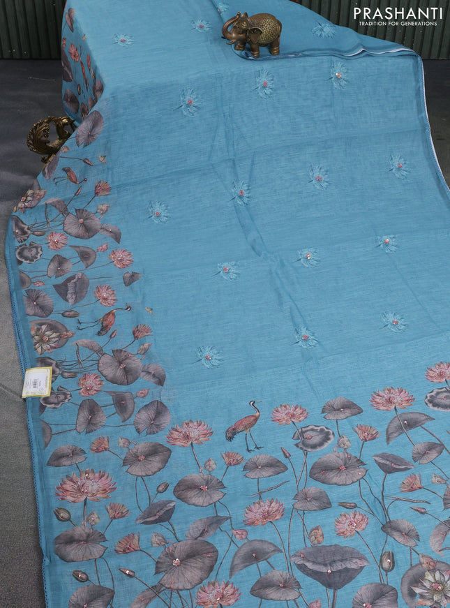 Linen cotton saree pastel blue with floral prints & embroidery buttas and long printed embrodery border