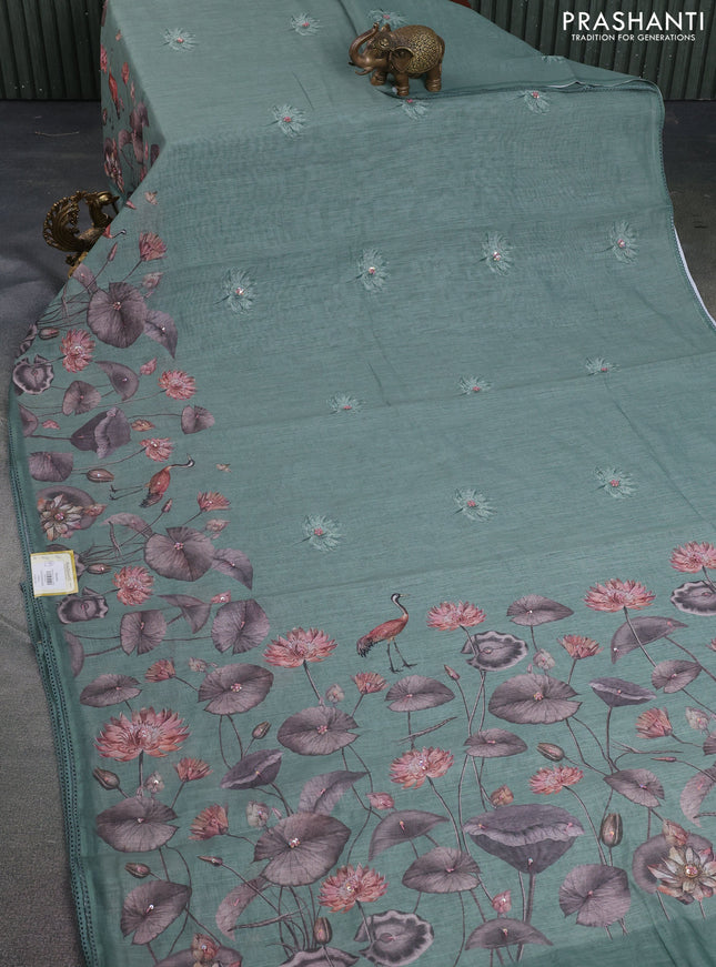 Linen cotton saree paatel green shade with floral prints & embroidery buttas and long printed embrodery border