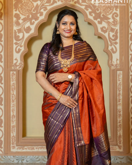 Pure soft silk saree rust and purple with allover zari weaves and long rich zari border