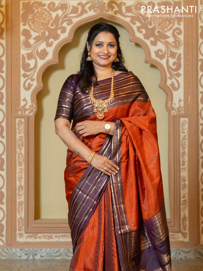 Pure soft silk saree rust and purple with allover zari weaves and long rich zari border