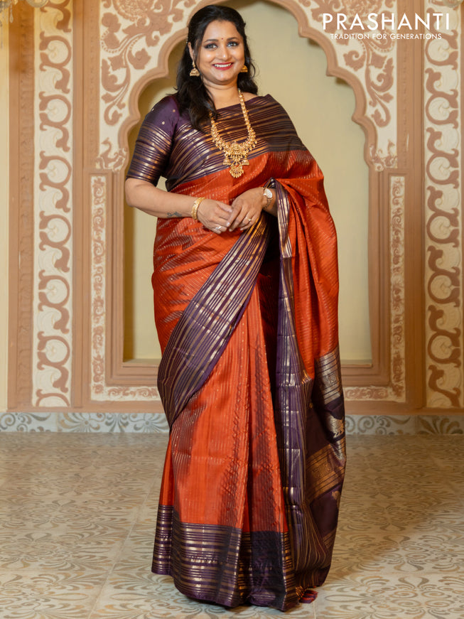Pure soft silk saree rust and purple with allover zari weaves and long rich zari border