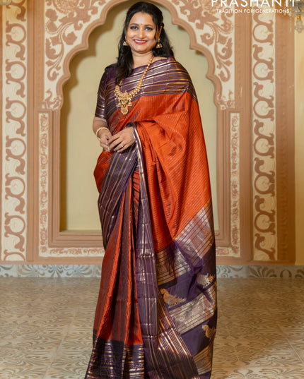 Pure soft silk saree rust and purple with allover zari weaves and long rich zari border