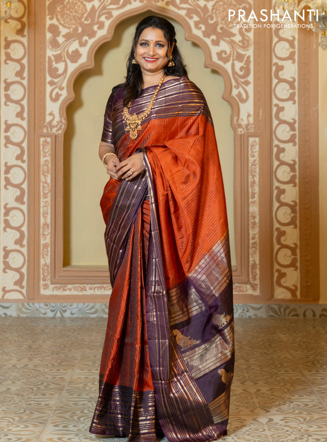 Pure soft silk saree rust and purple with allover zari weaves and long rich zari border