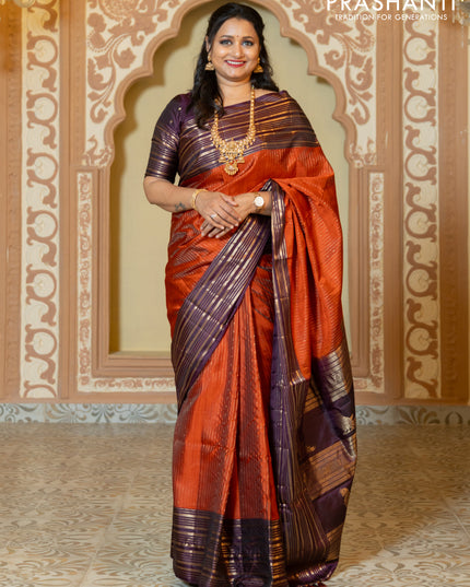Pure soft silk saree rust and purple with allover zari weaves and long rich zari border