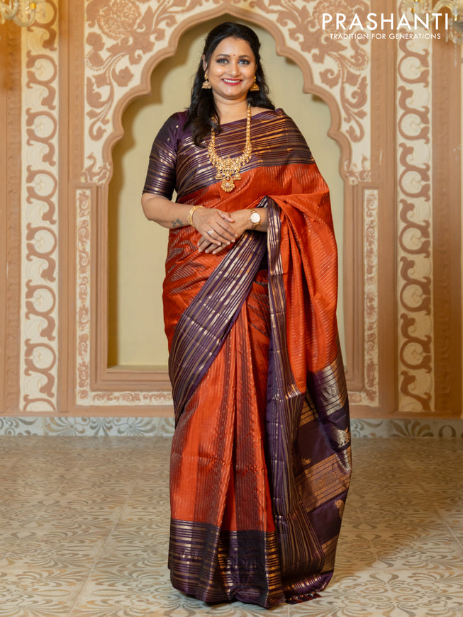 Pure soft silk saree rust and purple with allover zari weaves and long rich zari border