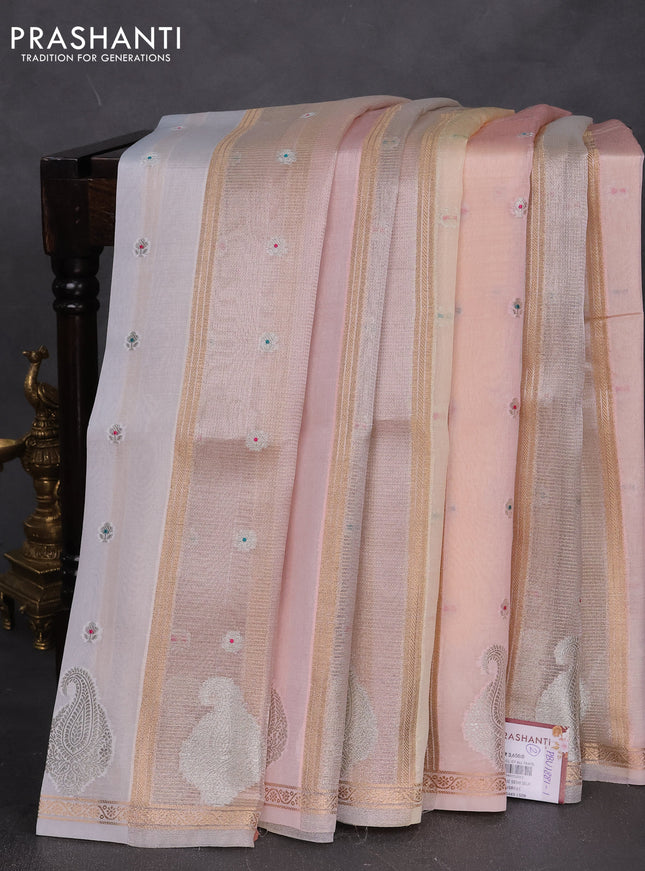 Banarasi tissue semi silk saree off white and cream with zari weaves & floral buttas and silver zari woven butta border