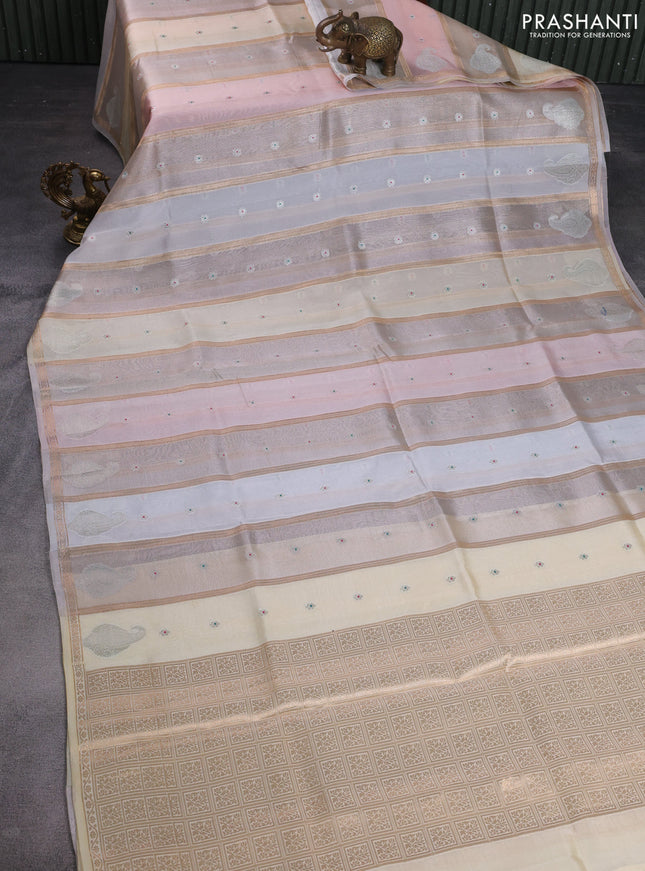 Banarasi tissue semi silk saree off white and cream with zari weaves & floral buttas and silver zari woven butta border