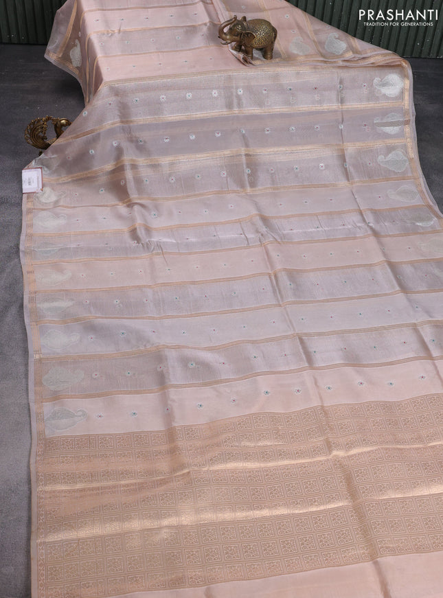 Banarasi tissue semi silk saree beige and pale orange with zari weaves & floral buttas and silver zari woven butta border