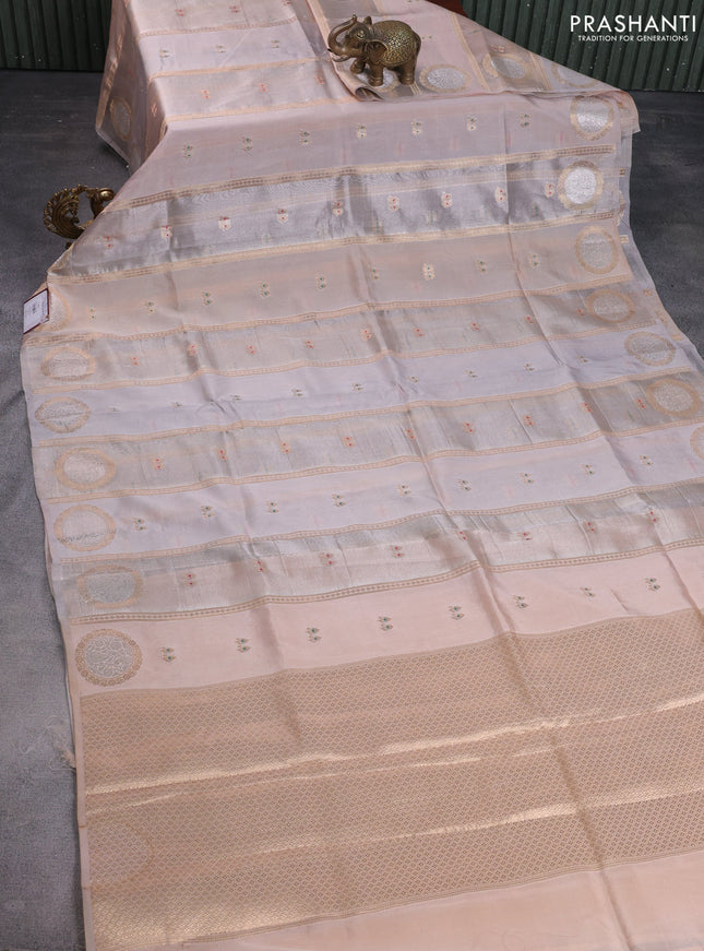 Banarasi tissue semi silk saree pastel grey and pale orange with zari weaves & buttas and zari woven butta border