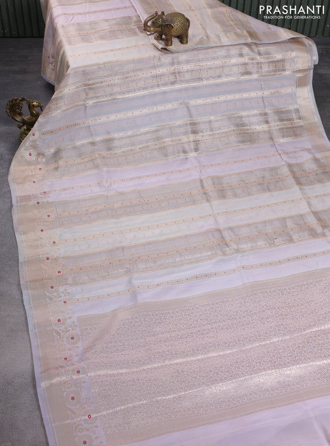 Banarasi tissue semi silk saree pastel grey and mild lavnder with allover zari weaves and zari woven floral border