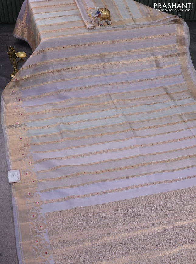 Banarasi tissue semi silk saree pastel shade and pastel lavender with allover zari weaves and zari woven floral border