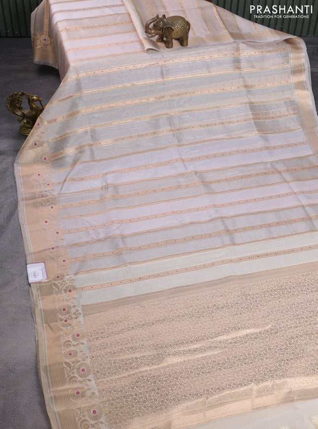 Banarasi tissue semi silk saree beige with allover zari weaves and zari woven floral border