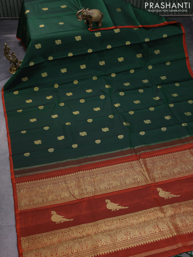 Pure kanchipuram silk saree dark green and rustic orange with annam & rudhraksha zari woven buttas and piping border