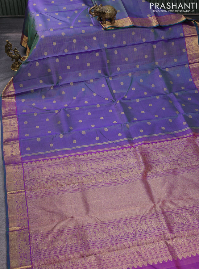 Pure kanchipuram silk saree dual shade of greenish violet and purple with allover zari weaves & buttas and elephant & annam zari woven border