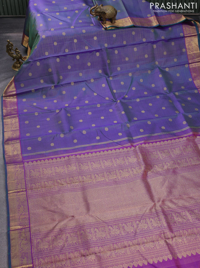 Pure kanchipuram silk saree dual shade of greenish violet and purple with allover zari weaves & buttas and elephant & annam zari woven border
