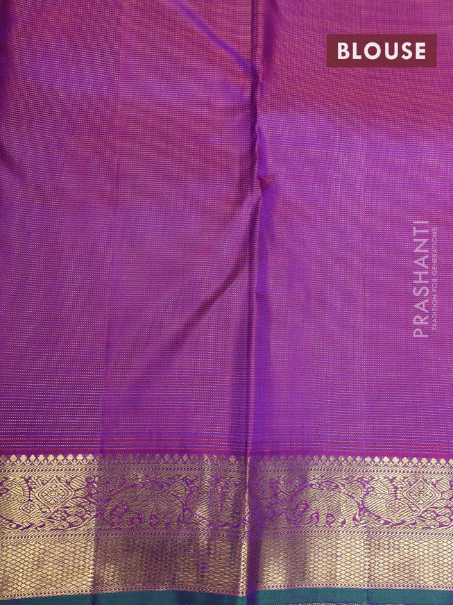 Pure kanchipuram silk saree dual shade of greenish violet and purple with allover zari weaves & buttas and elephant & annam zari woven border