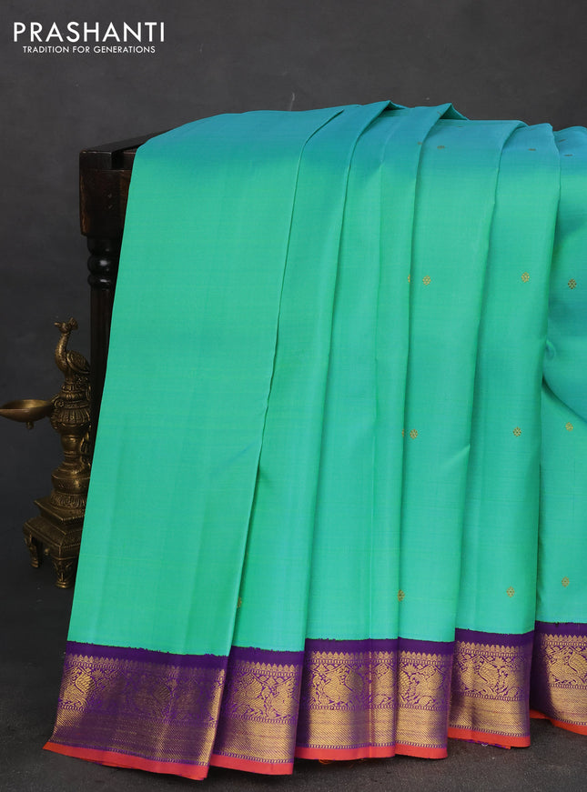 Pure kanchipuram silk saree dual shade of teal bluish green and violet with zari woven buttas and rich zari woven korvai border