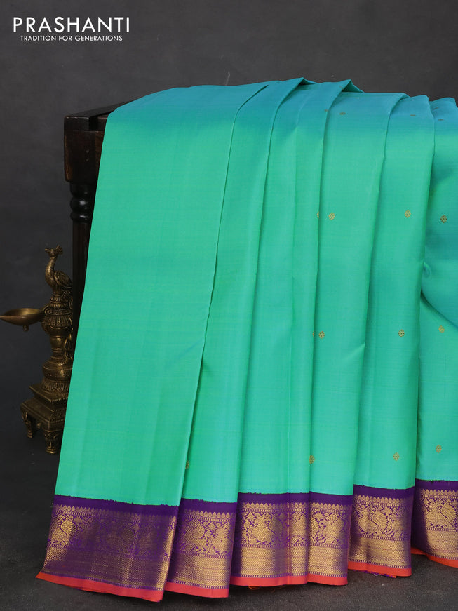 Pure kanchipuram silk saree dual shade of teal bluish green and violet with zari woven buttas and rich zari woven korvai border