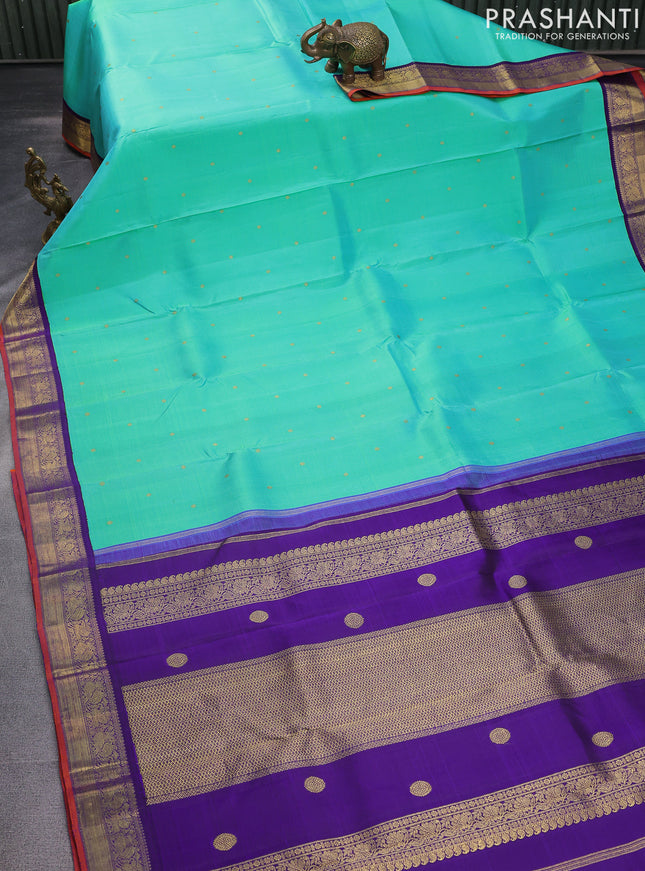Pure kanchipuram silk saree dual shade of teal bluish green and violet with zari woven buttas and rich zari woven korvai border