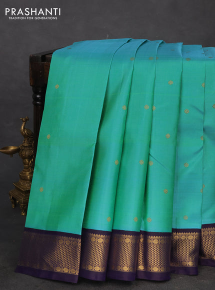 Pure kanchipuram silk saree dual shade of teal blue and dark blue with zari woven buttas and rich zari woven korvai border