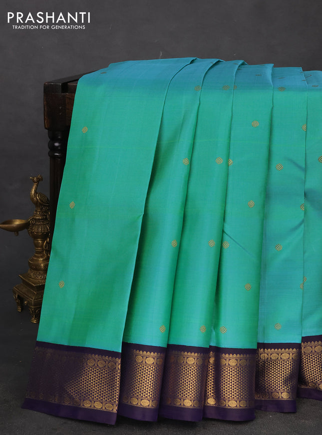 Pure kanchipuram silk saree dual shade of teal blue and dark blue with zari woven buttas and rich zari woven korvai border