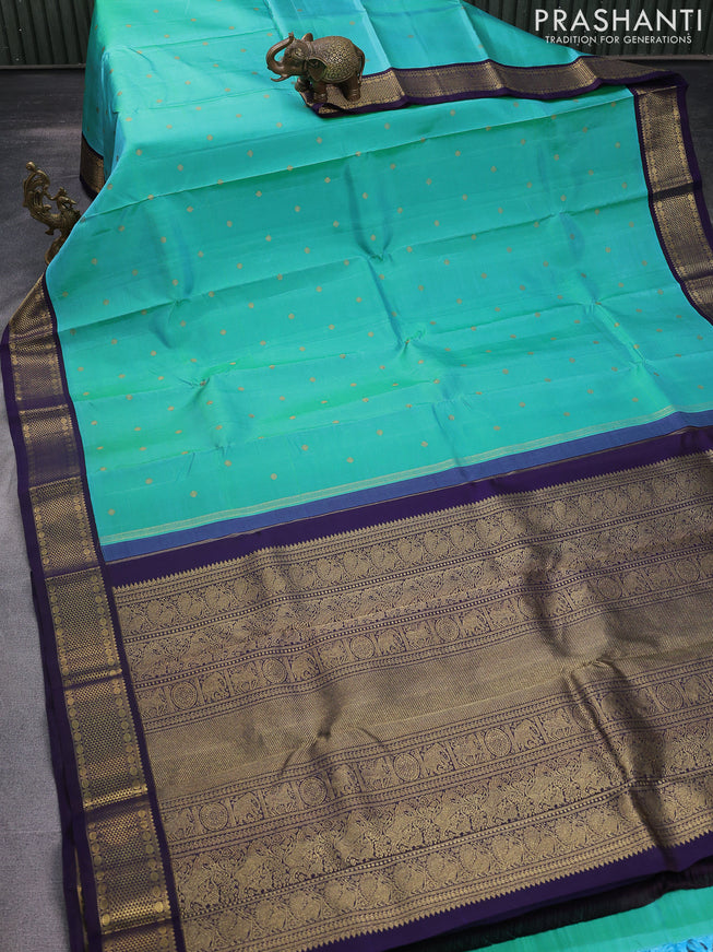 Pure kanchipuram silk saree dual shade of teal blue and dark blue with zari woven buttas and rich zari woven korvai border