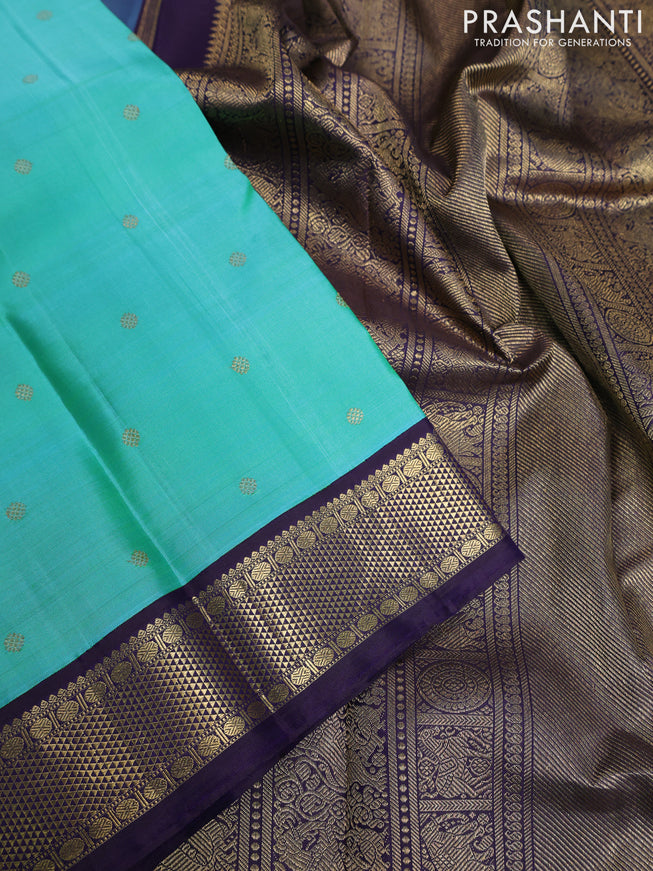 Pure kanchipuram silk saree dual shade of teal blue and dark blue with zari woven buttas and rich zari woven korvai border