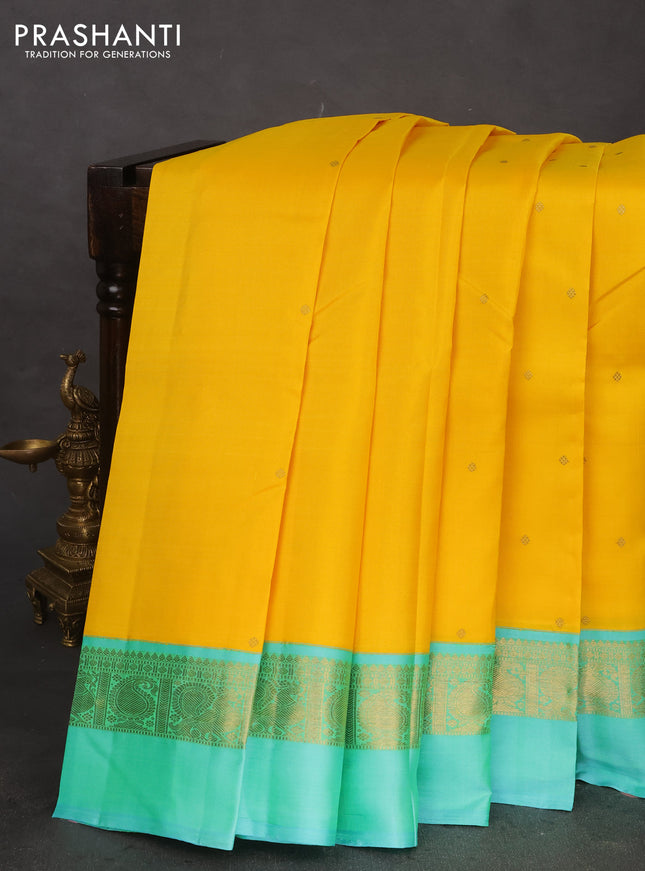 Pure kanchipuram silk saree yellow and teal blue with zari woven buttas and zari woven simple border