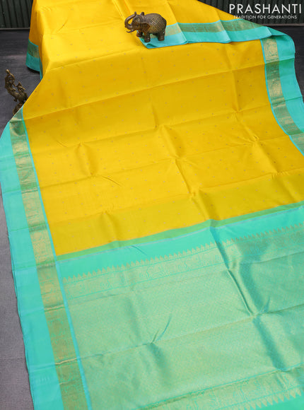 Pure kanchipuram silk saree yellow and teal blue with zari woven buttas and zari woven simple border