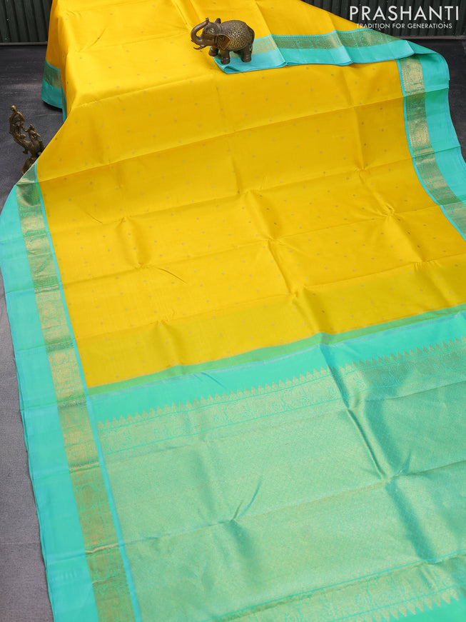 Pure kanchipuram silk saree yellow and teal blue with zari woven buttas and zari woven simple border