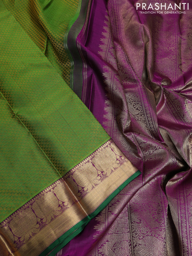 Pure kanchipuram silk saree green and purple with allover paisley self emboss and floral zari woven border