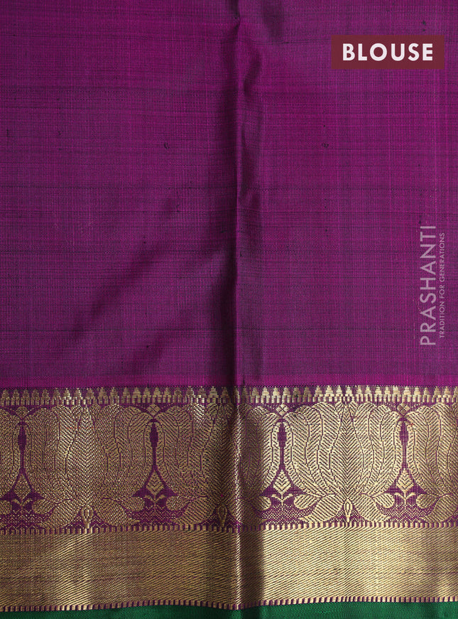 Pure kanchipuram silk saree green and purple with allover paisley self emboss and floral zari woven border