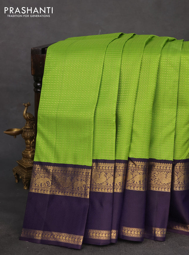 Pure kanchipuram silk saree light green and deep jamun with allover zari woven lakshadeepam pattern and rich zari woven simple border