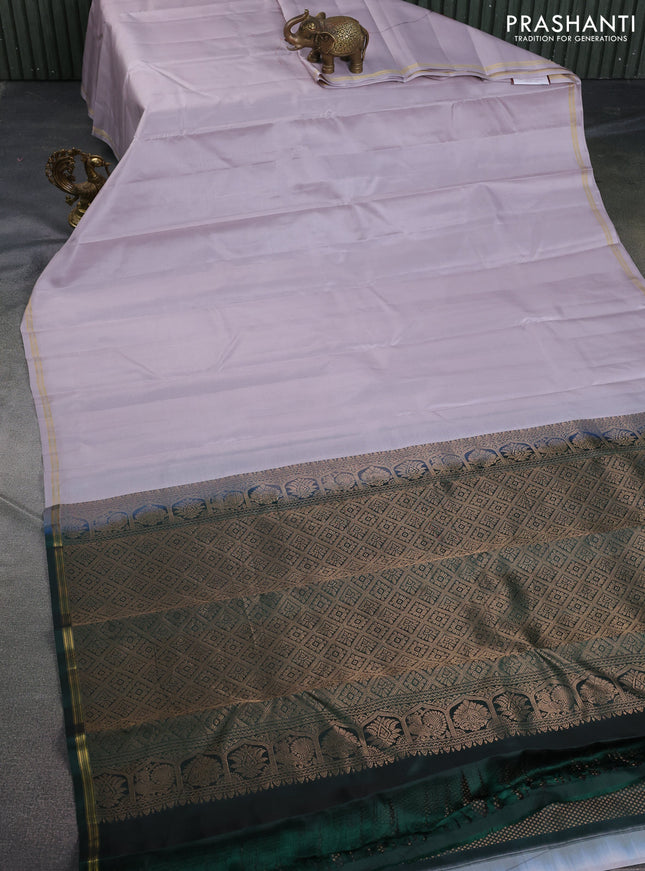 Pure kanchipuram silk saree pastel grey and bottle green with plain body and small zari woven simple border