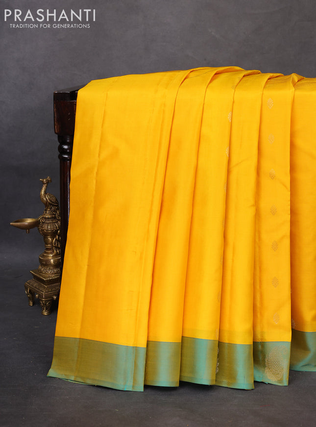 Pure kanchipuram silk saree yellow and dual shade of teal blue with allover zari woven buttas and zari woven butta border