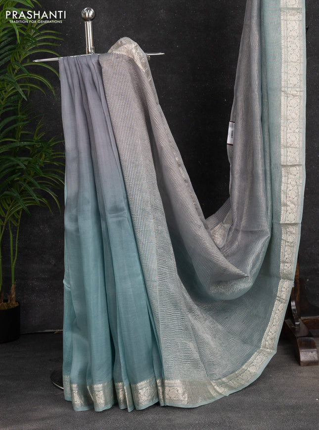 Pure organza partly silk saree pastel blue and grey with allover silver zari weaves and silver zari woven border