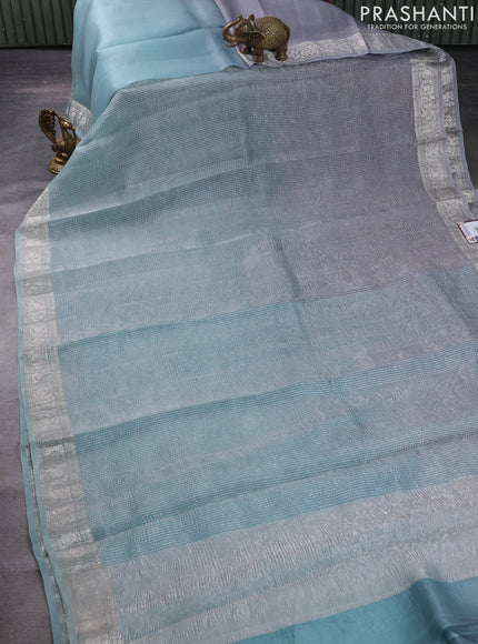 Pure organza partly silk saree pastel blue and grey with allover silver zari weaves and silver zari woven border