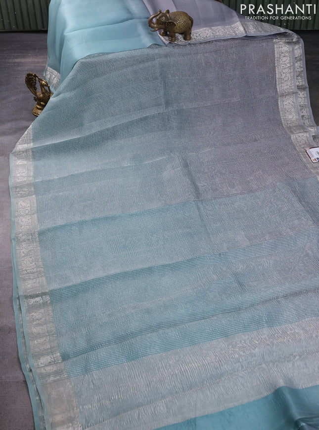 Pure organza partly silk saree pastel blue and grey with allover silver zari weaves and silver zari woven border