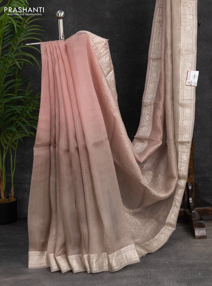Pure organza partly silk saree grey shade and paste peach with allover silver zari weaves and silver zari woven border