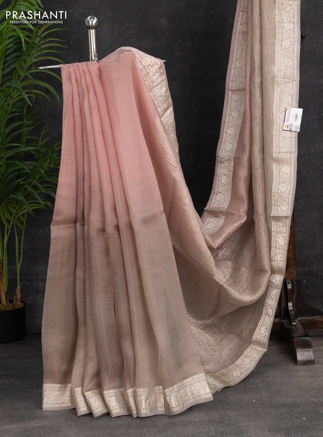 Pure organza partly silk saree grey shade and paste peach with allover silver zari weaves and silver zari woven border